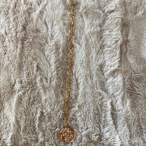 Simple gold necklace with coin